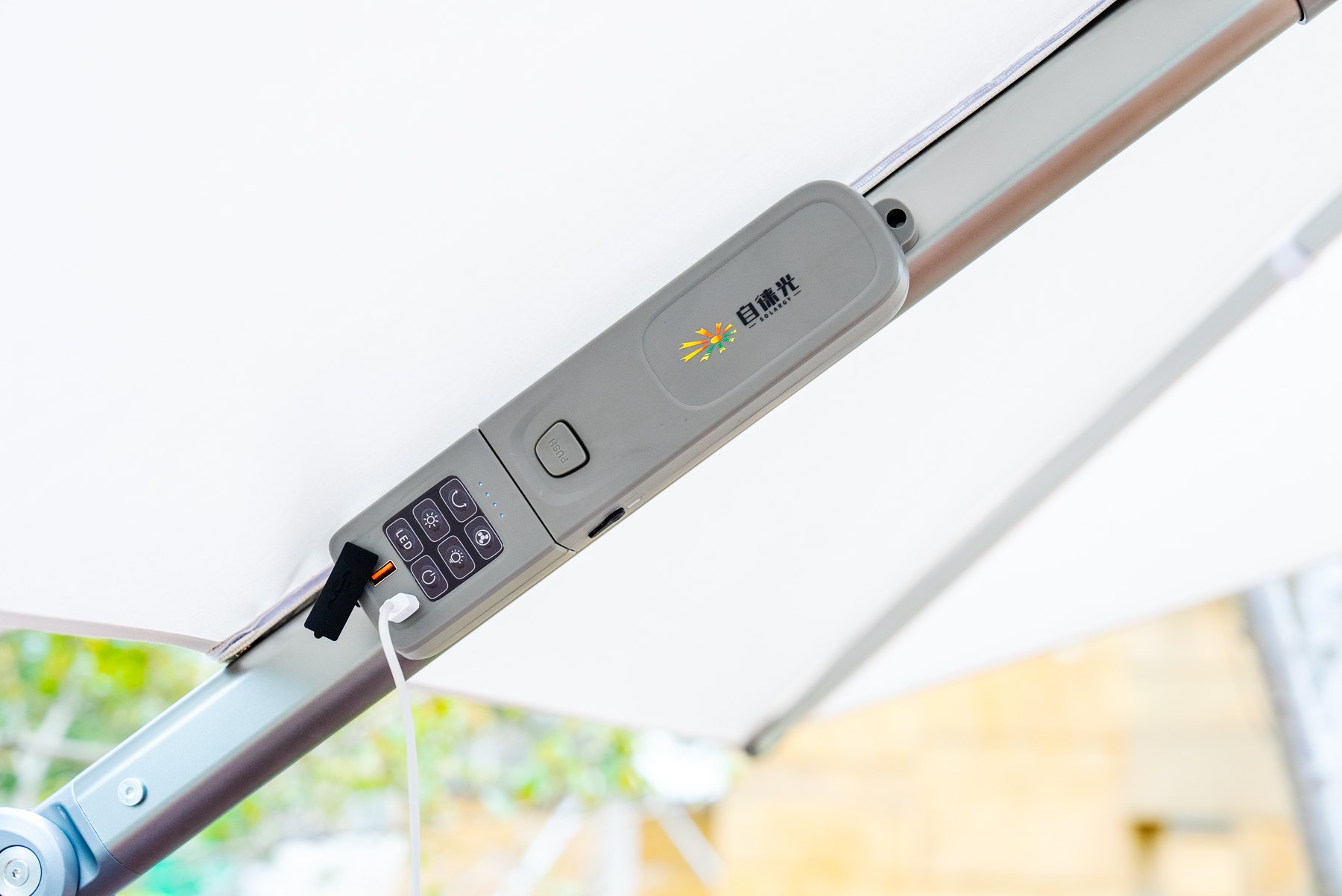 Integrated solar umbrella control panel with charging connection
