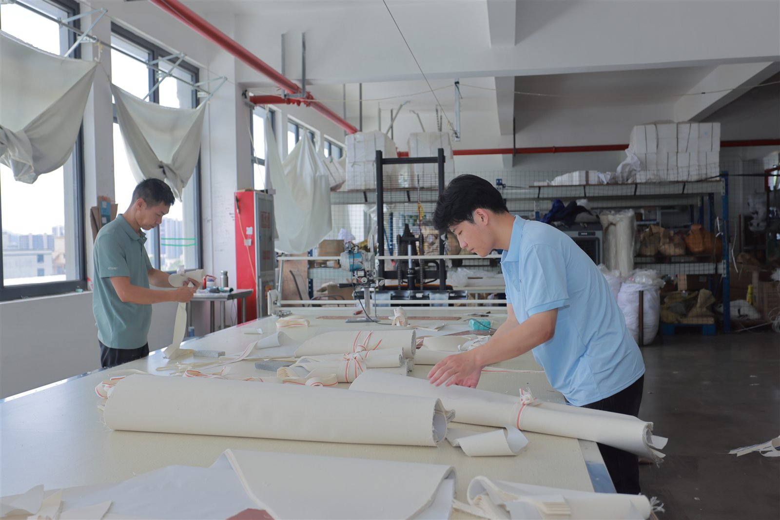 Pattern preparation and fabric cutting in the workshop.